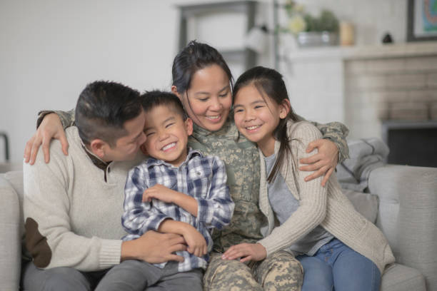 Asian military family sharing a warm and supportive moment at home