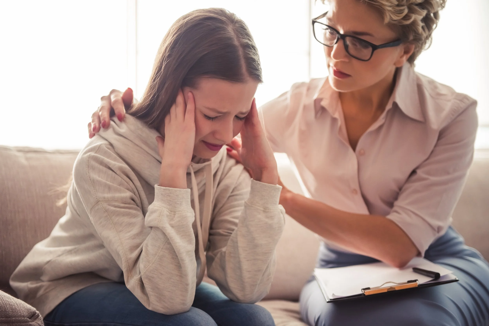 Counselor providing emotional support to a military-connected child